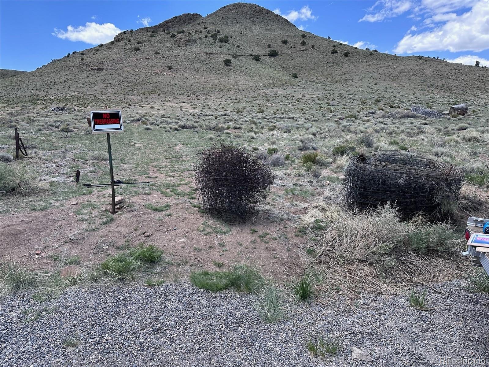 Spruce Street Del Norte, CO 81132 - Photo 18 of 50 a view of a dry yard with mountain