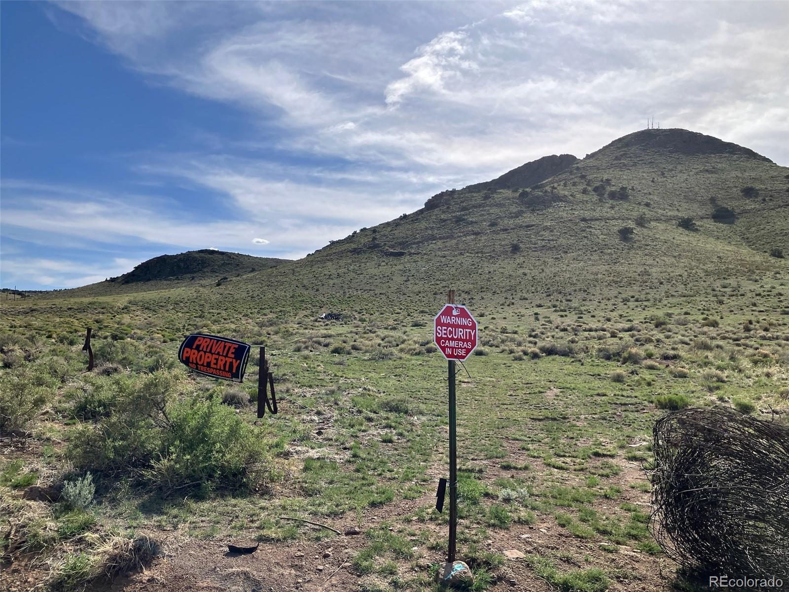 Spruce Street Del Norte, CO 81132 - Photo 25 of 50 a front view of a house with a forest