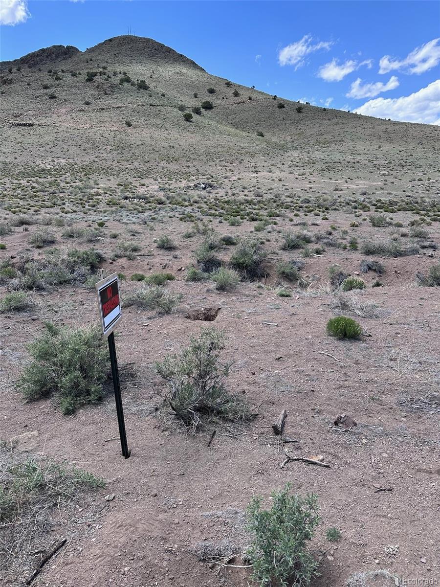 Spruce Street Del Norte, CO 81132 - Photo 30 of 50 a street sign on a rock