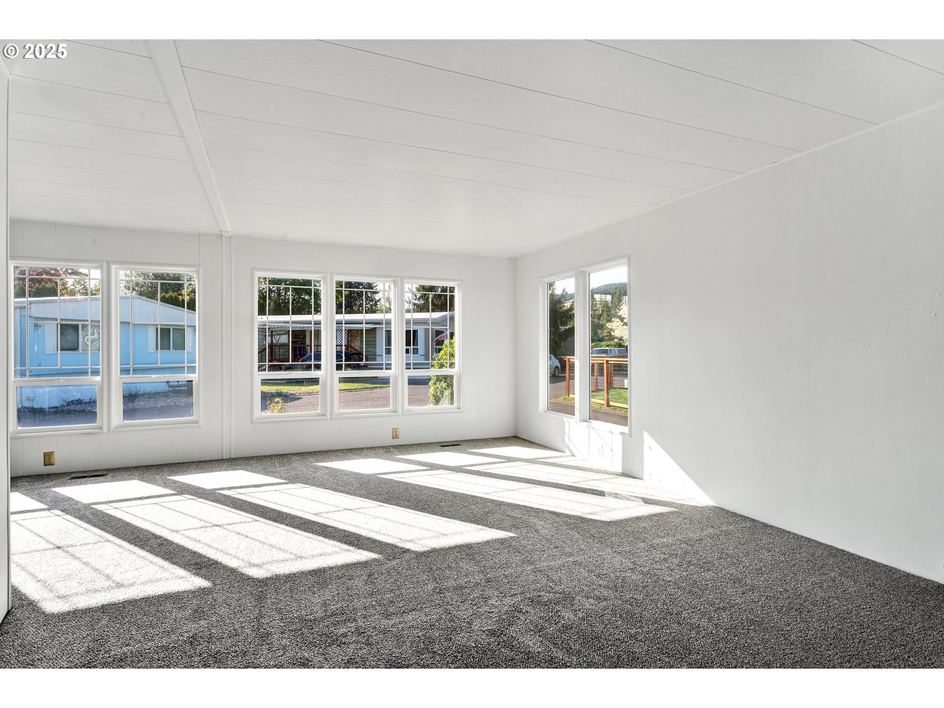 39202 Camp Creek Road, Unit 7 Springfield, OR 97478 - Photo 11 of 39 a view of a bedroom with wooden floor and windows