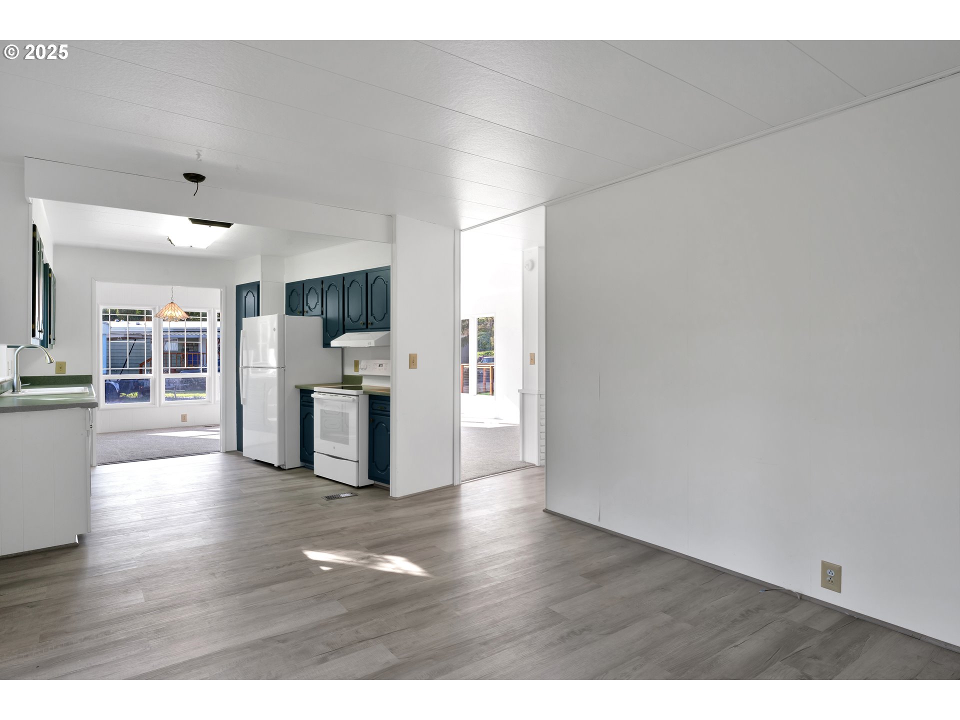 39202 Camp Creek Road, Unit 7 Springfield, OR 97478 - Photo 22 of 39 a view of a kitchen with wooden floor