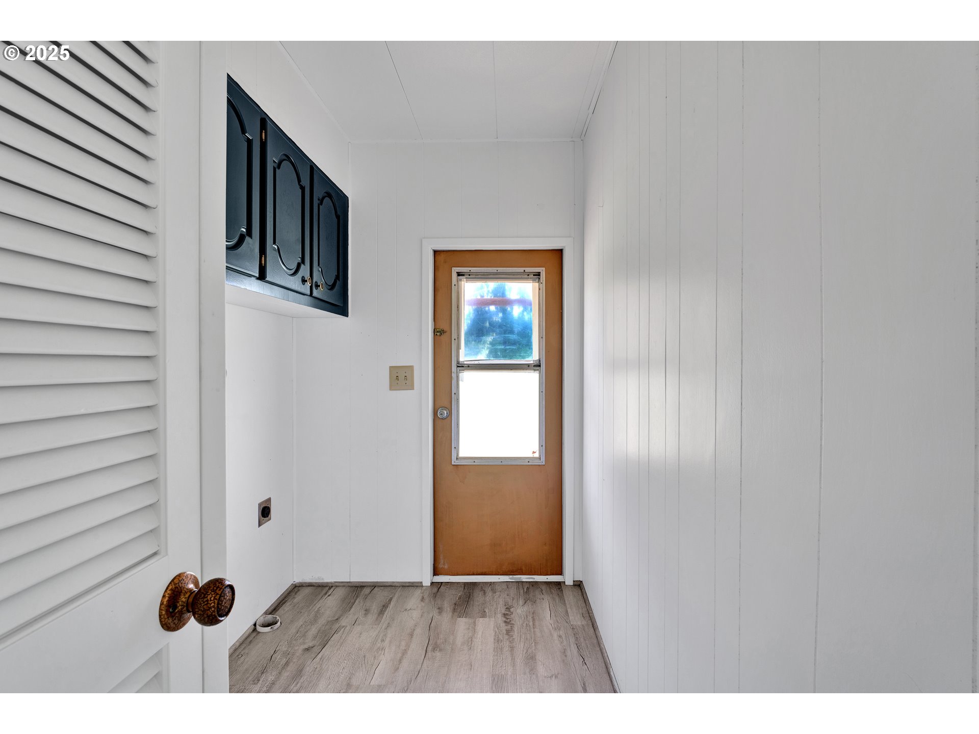 39202 Camp Creek Road, Unit 7 Springfield, OR 97478 - Photo 29 of 39 a view of an empty room with wooden floor