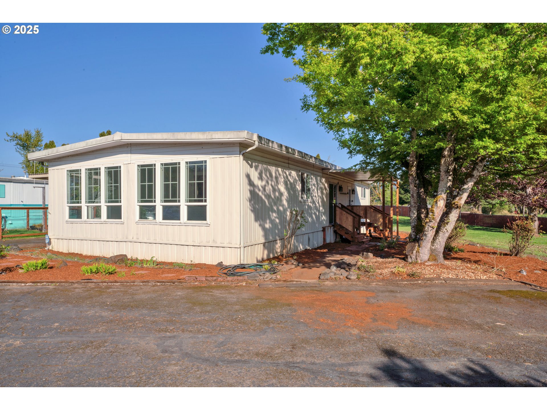 39202 Camp Creek Road, Unit 7 Springfield, OR 97478 - Photo 5 of 39 a front view of a house with a yard