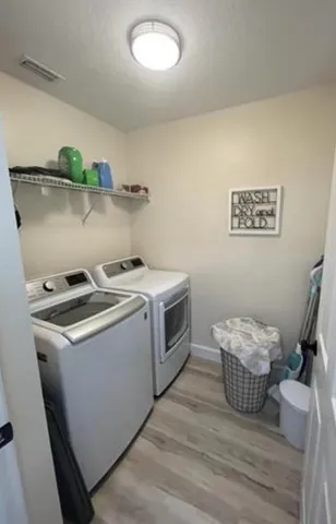 a utility room with dryer and washer