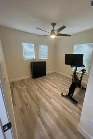 a bedroom with bed and window