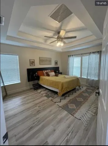 a bedroom with a bed and window