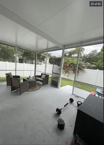a view of an house with backyard space and balcony