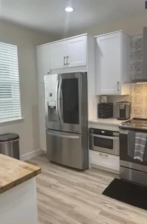 a kitchen with a stove and a microwave