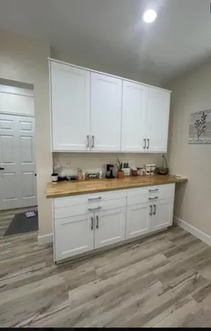 a view of cabinets with wooden floor