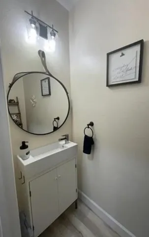 a bathroom with a sink and mirror