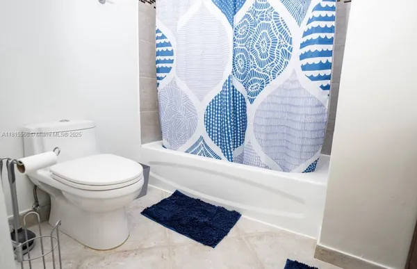 a bathroom with a toilet and a sink