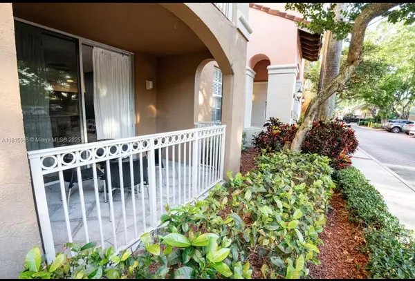 a view of a swimming pool and outdoor seating