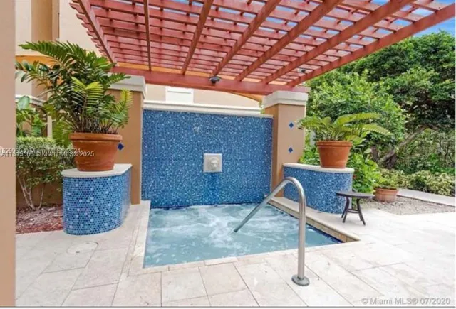 a view of a patio with table and chairs with wooden floor and fence