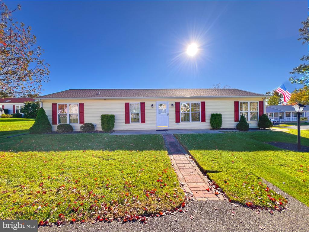 a view of house with swimming pool yard and outdoor seating