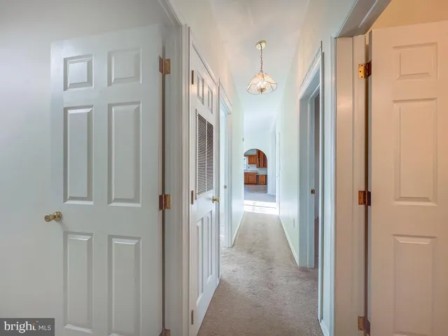 a large kitchen with stainless steel appliances granite countertop a sink and cabinets