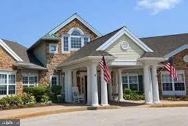 front view of a house with a small yard