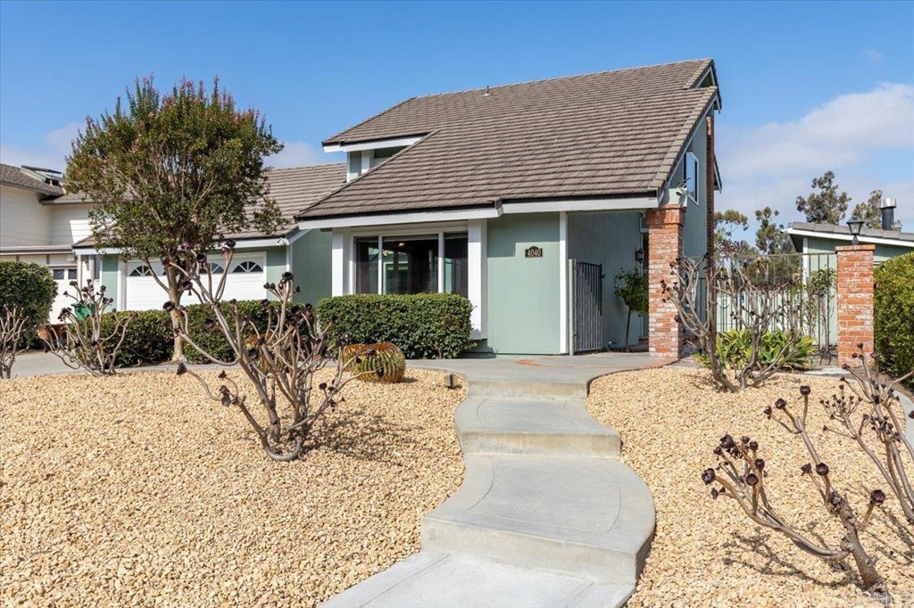 4040 Risa Circle San Diego, CA 92124 - Photo 4 of 43 a front view of a house with a yard