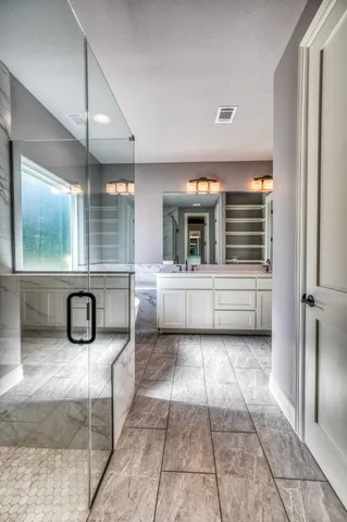 a bathroom with a sink and mirror