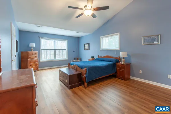 a bedroom with furniture and window