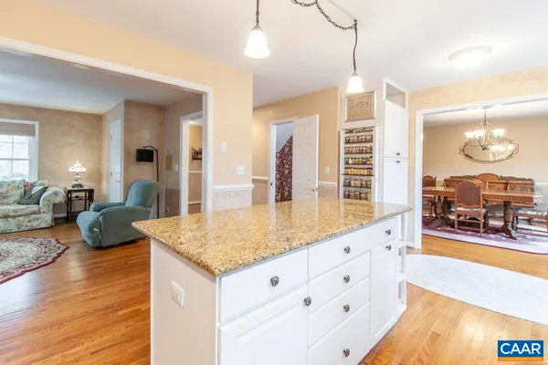 a view of living room with granite countertop furniture and fireplace