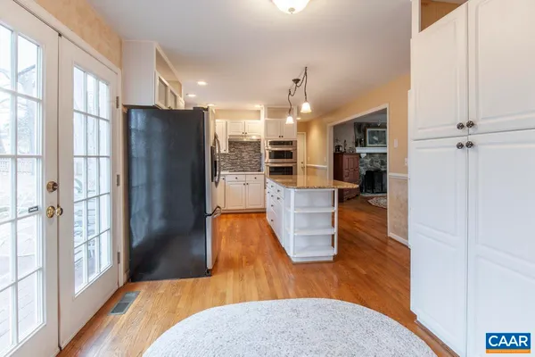 a view of a kitchen from the hallway