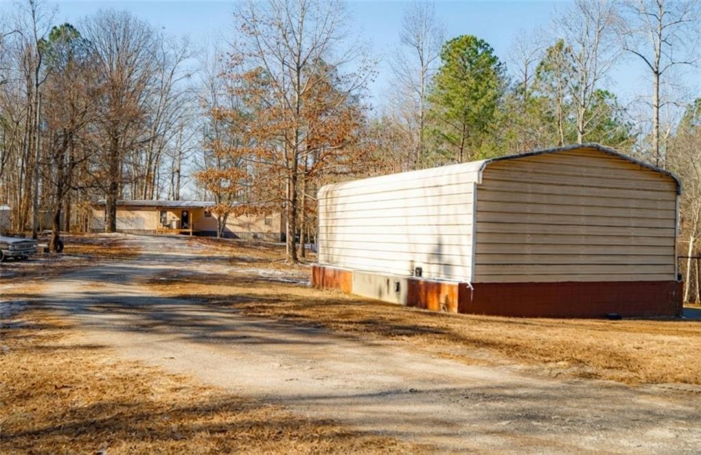 7324 Freeman Road Dawsonville, GA 30534 - Photo 3 of 7 a view of a house with a yard