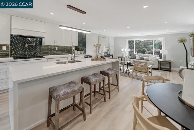 a bathroom with a double vanity sink toilet and shower