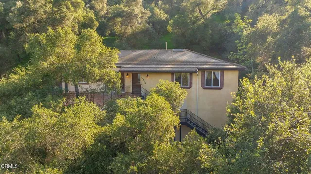 a house view with a backyard space