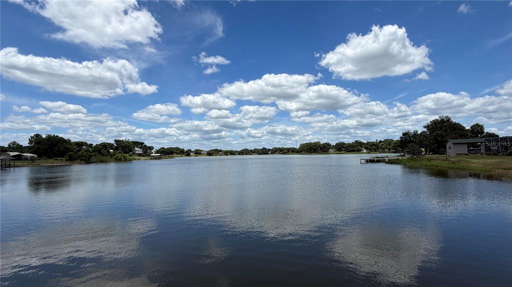 0 Lakeview Street Umatilla, FL 32784 - Photo 4 of 14 a view of a lake from a yard