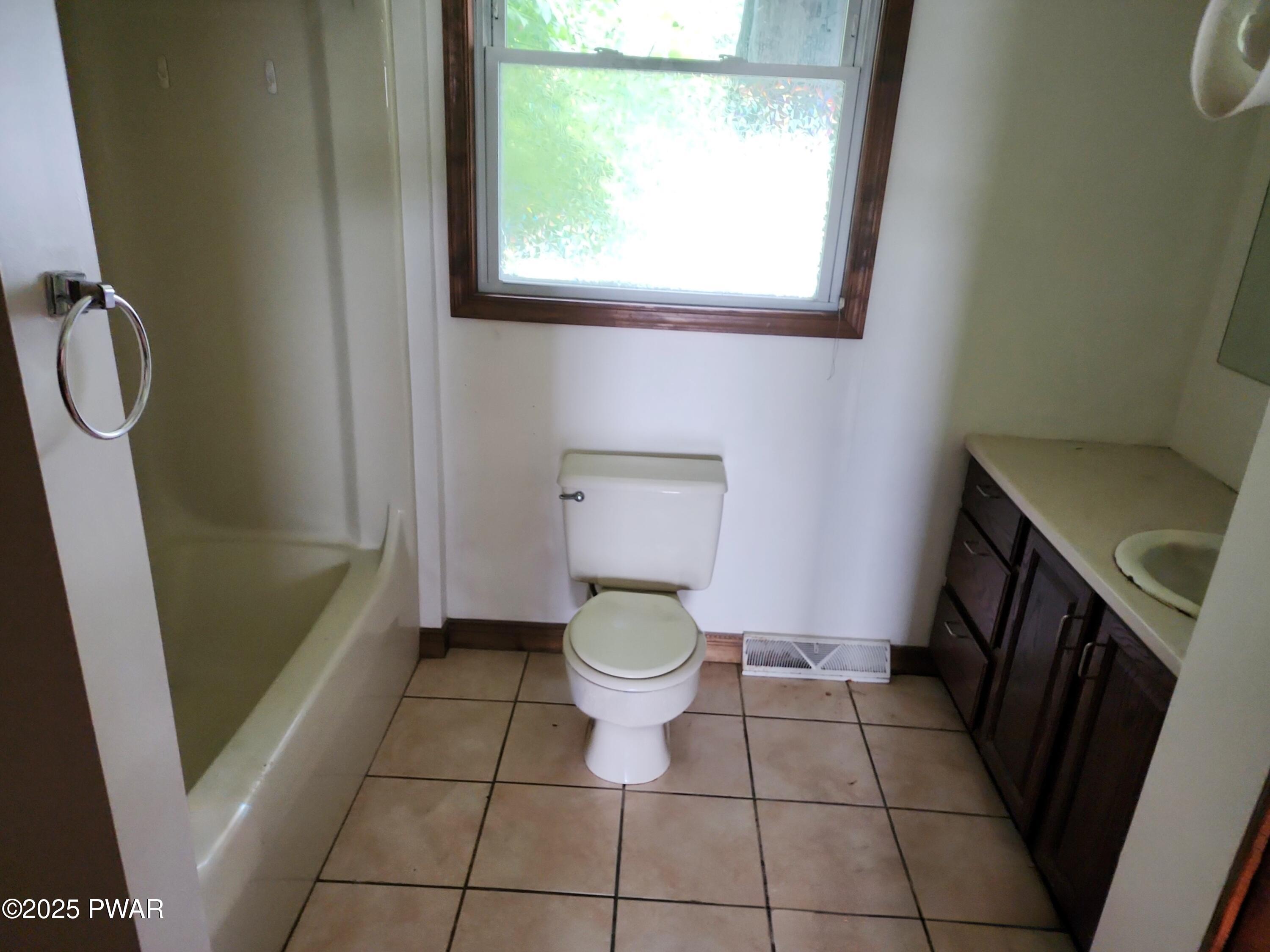 961 Aberdeen Road Moscow, PA 18444 - Photo 13 of 26 a bathroom with a toilet a sink and a shower