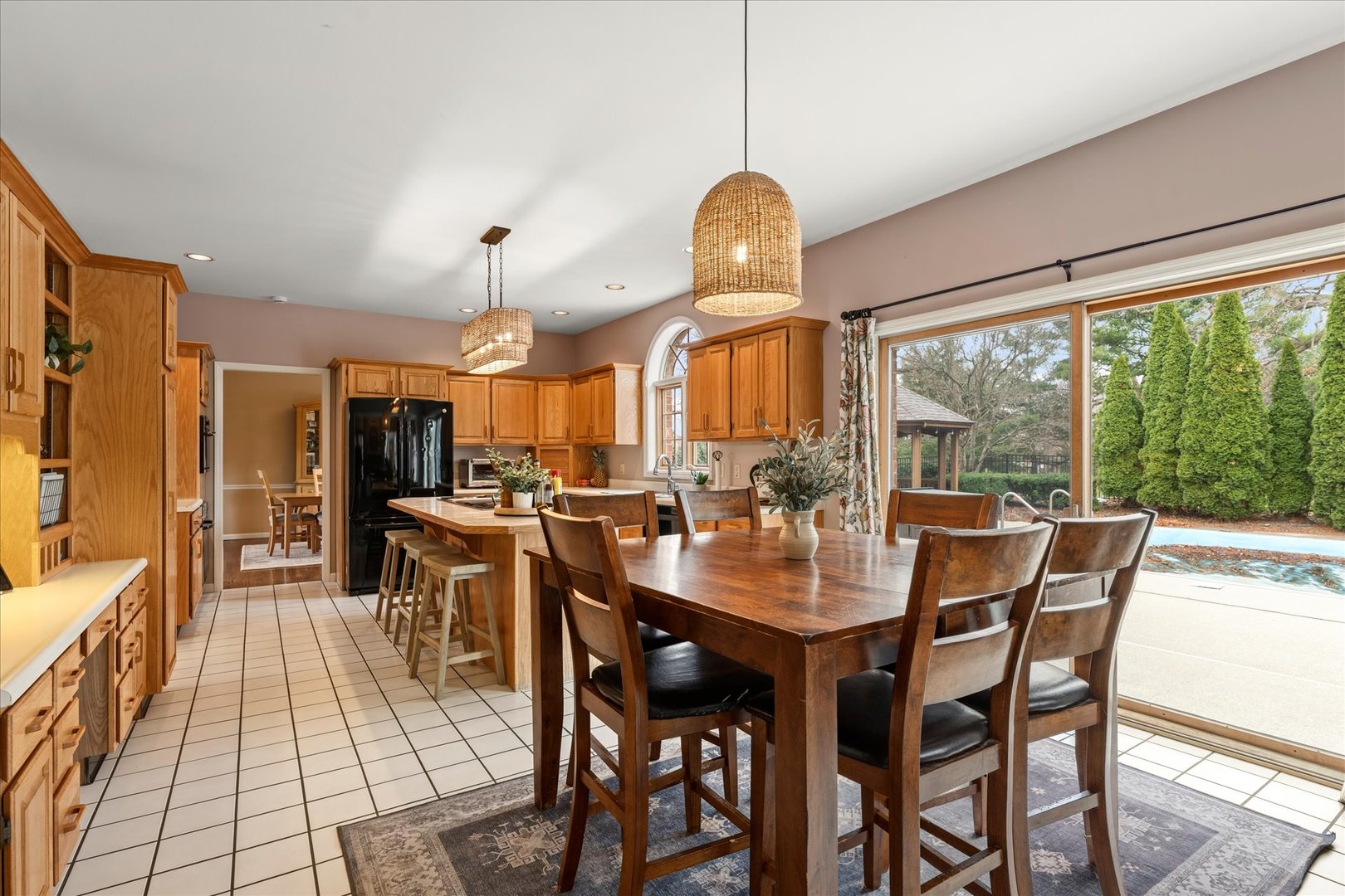1303 Hickory Tree Court Mahomet, IL 61853 - Photo 19 of 63 a view of a dining room with furniture window and outside view