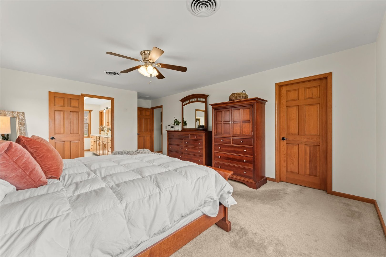 1303 Hickory Tree Court Mahomet, IL 61853 - Photo 41 of 63 a bedroom with a bed and wooden furniture