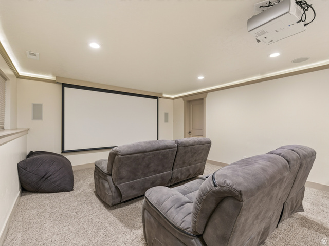 1279 West 1500th Street North Mapleton, UT 84664 - Photo 55 of 83 Dedicated media room featuring a large projection screen, mounted projector, recessed lighting, integrated sound speakers, and light-colored carpet flooring