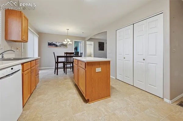 a view of kitchen with furniture and wooden floor