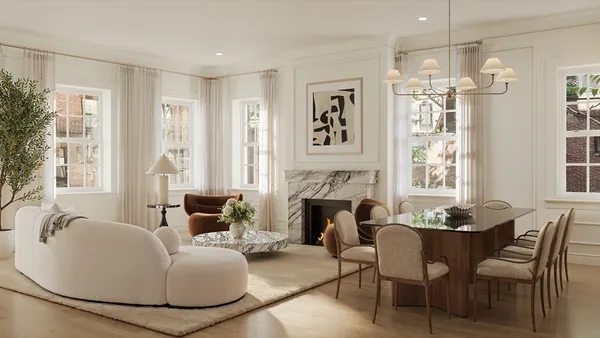 a living room with furniture a fireplace and a chandelier