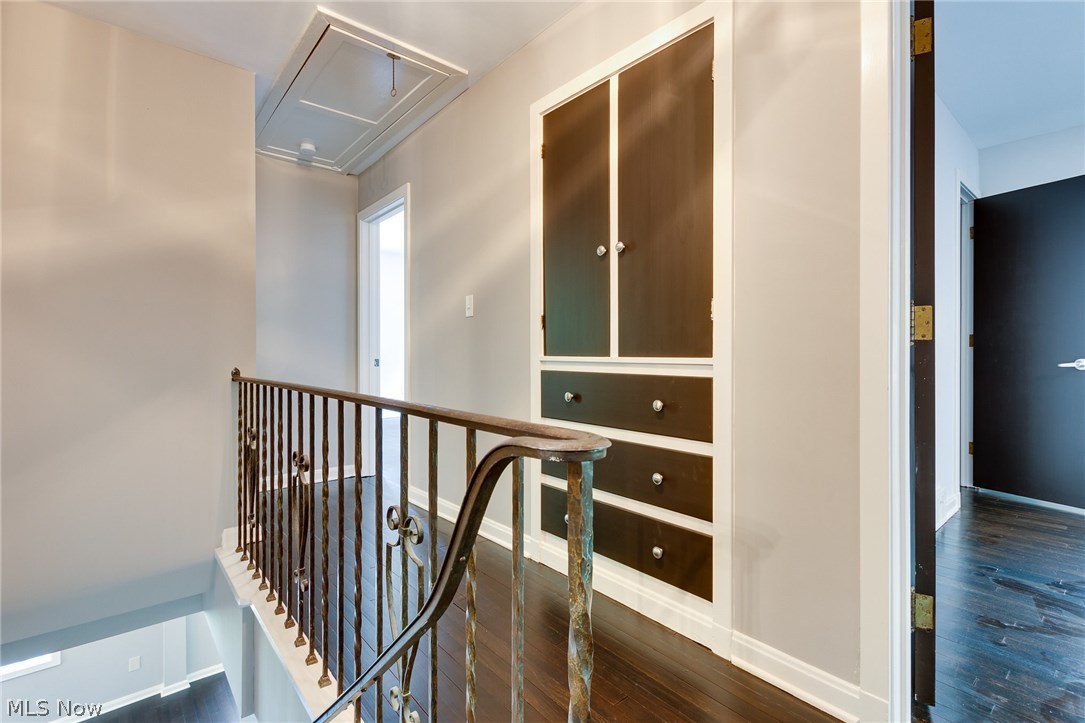1046 Allston Road Cleveland Heights, OH 44121 - Photo 21 of 34 The second floor hall has original wrought iron railing and large built in linen closet. Note the pull down stairs that lead to the attic large enough for all your storage needs.