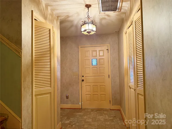 a view of a big room with windows