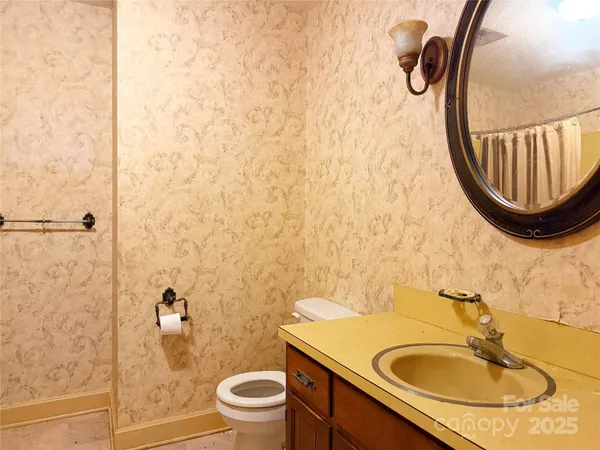 a bathroom with a shower and a sink