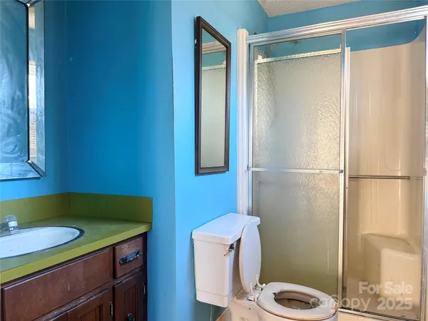 a view of a room with window chandelier fan and carpet