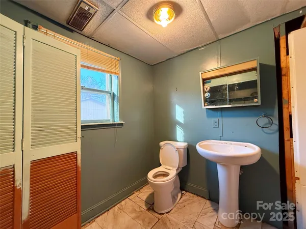 a bathroom with a tub and shower curtain