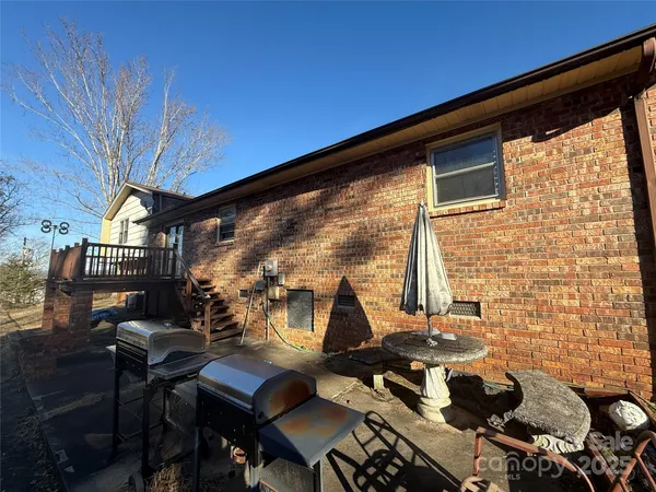 a view of balcony with furniture