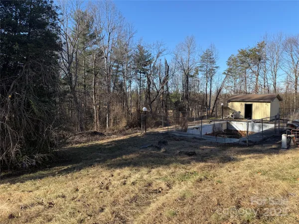 a view of a backyard with trees