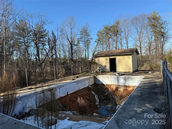 a view of a swimming pool with a patio