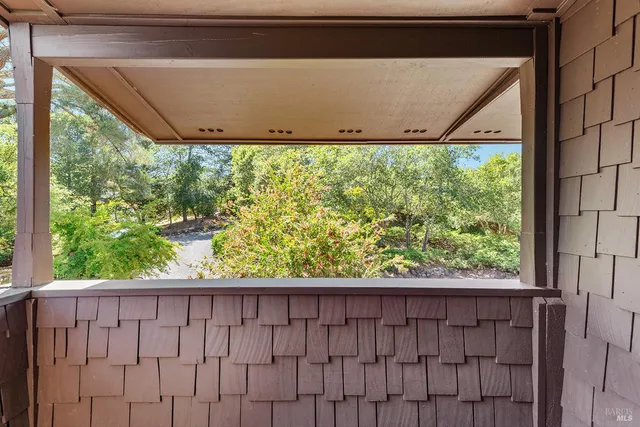 a view of a house with a tree in front
