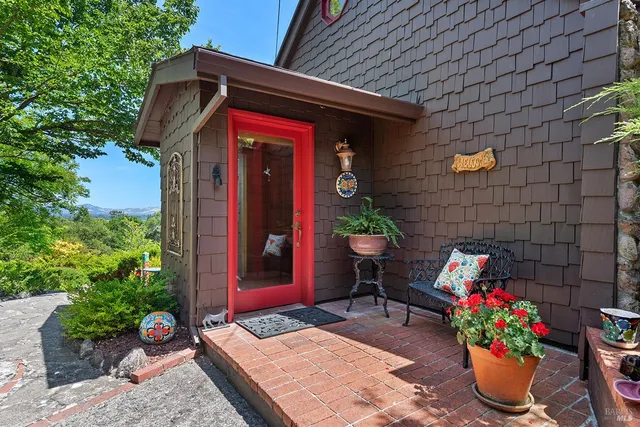 a view of a two chairs in the balcony