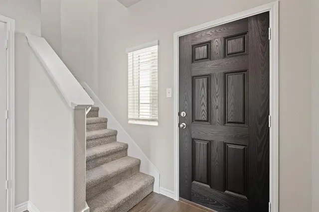 a kitchen with stainless steel appliances granite countertop a sink stove and microwave