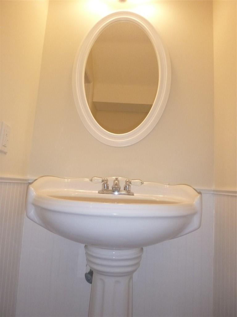 745 Falling Water Road Weston, FL 33326 - Photo 30 of 34 a bathroom with a sink and a mirror
