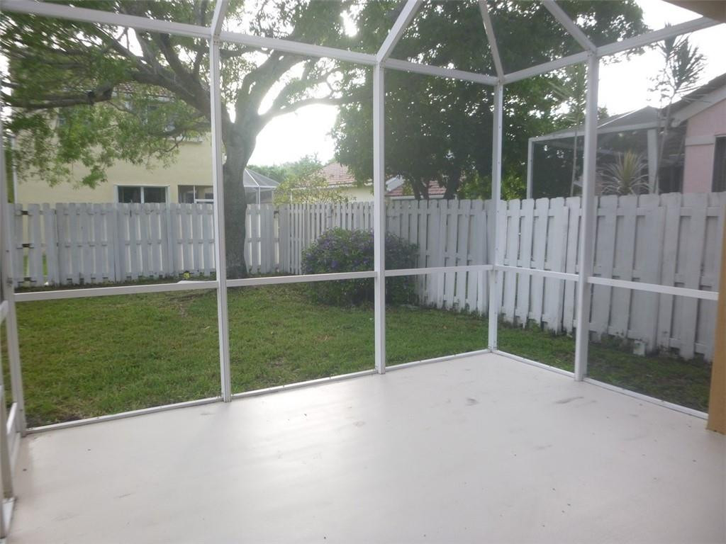 745 Falling Water Road Weston, FL 33326 - Photo 4 of 34 a view of backyard with green space