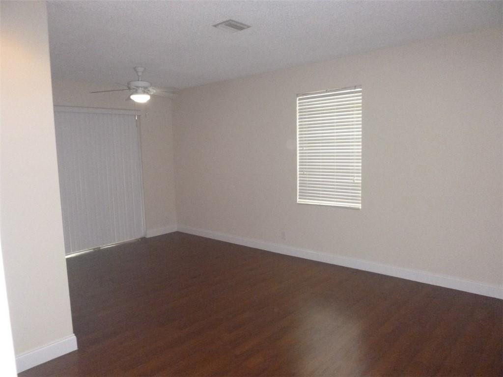 745 Falling Water Road Weston, FL 33326 - Photo 9 of 34 an empty room with a window