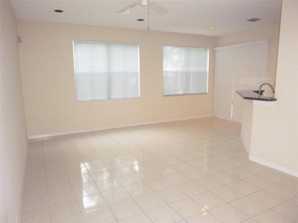 745 Falling Water Road Weston, FL 33326 - Photo 10 of 34 an empty room with windows